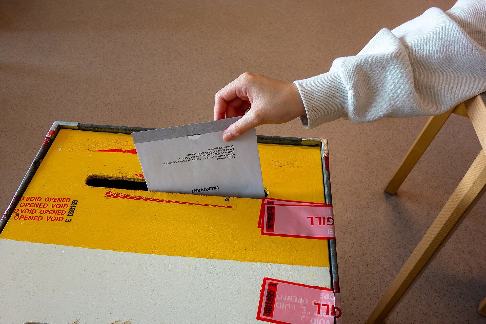 A ballot being dropped into a ballot box