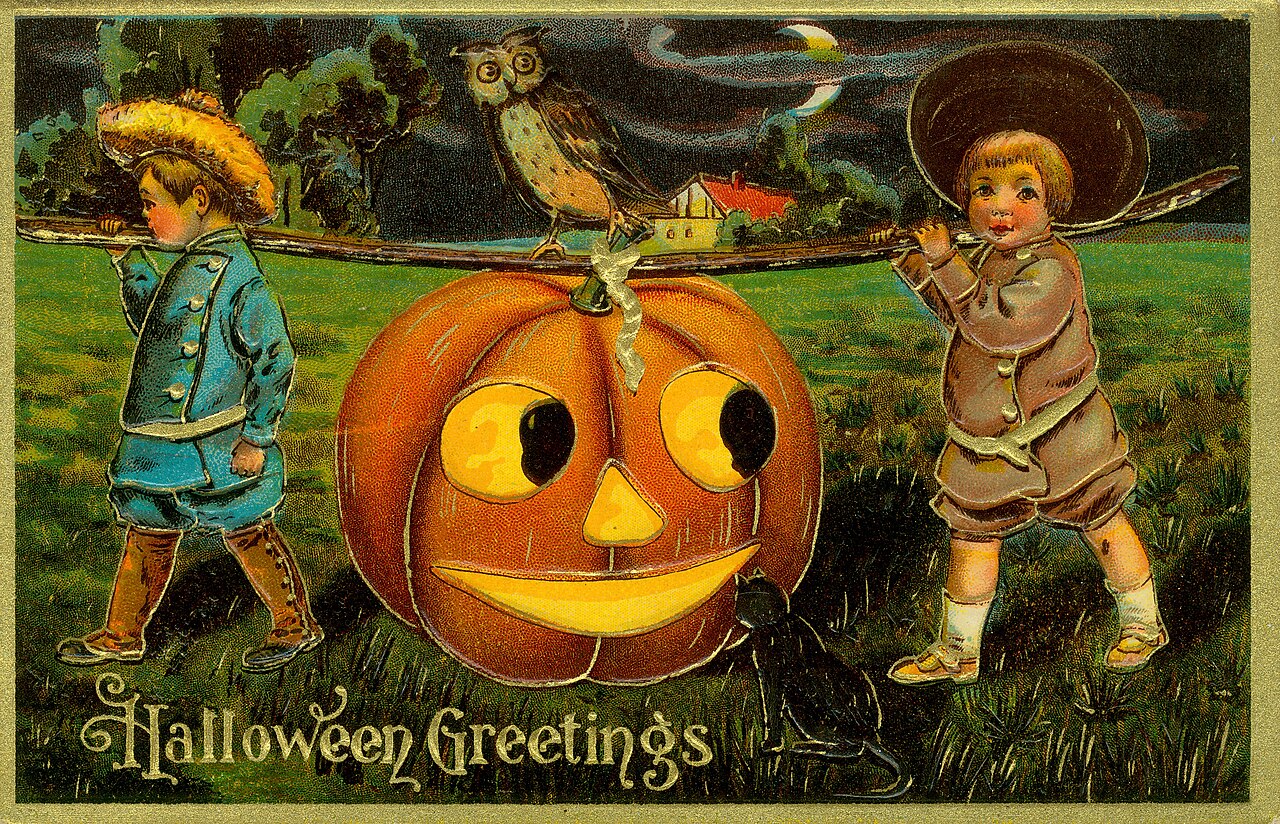 Two children carrying a large jack-o'-lantern