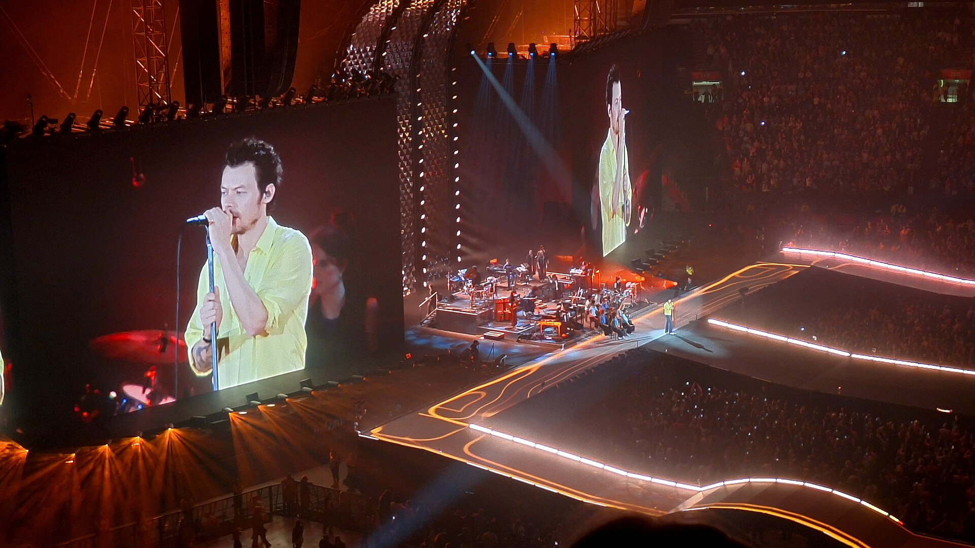 Harry Styles performing on stage