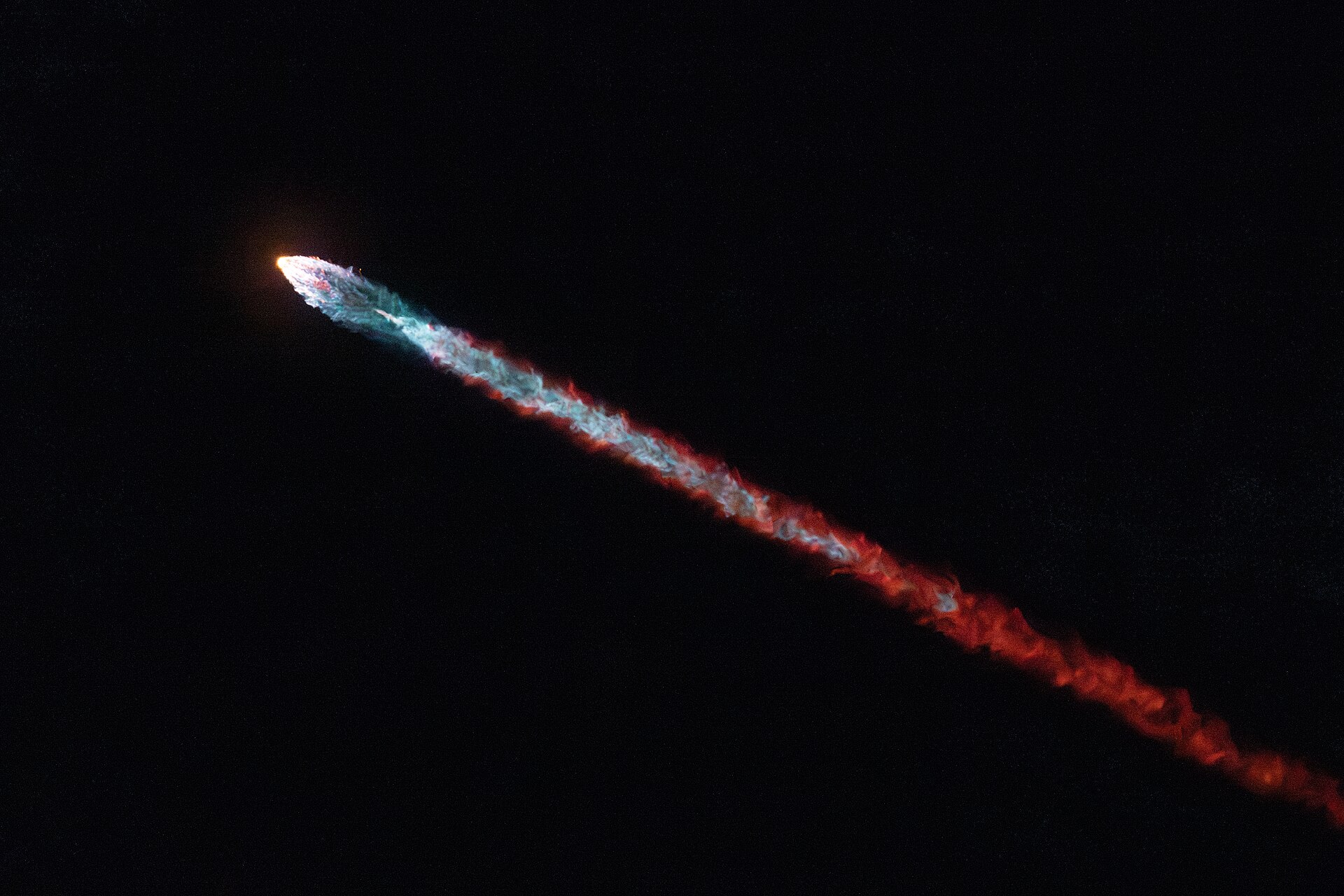 A rocket lifting off at night
